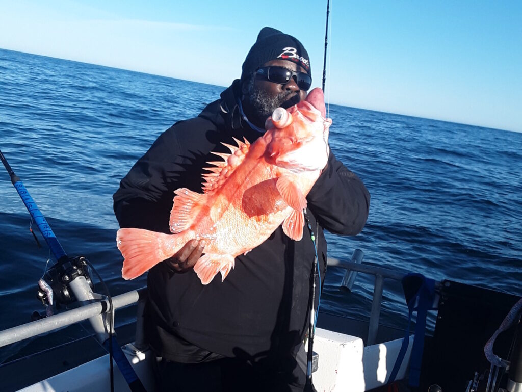 Man kissing fish